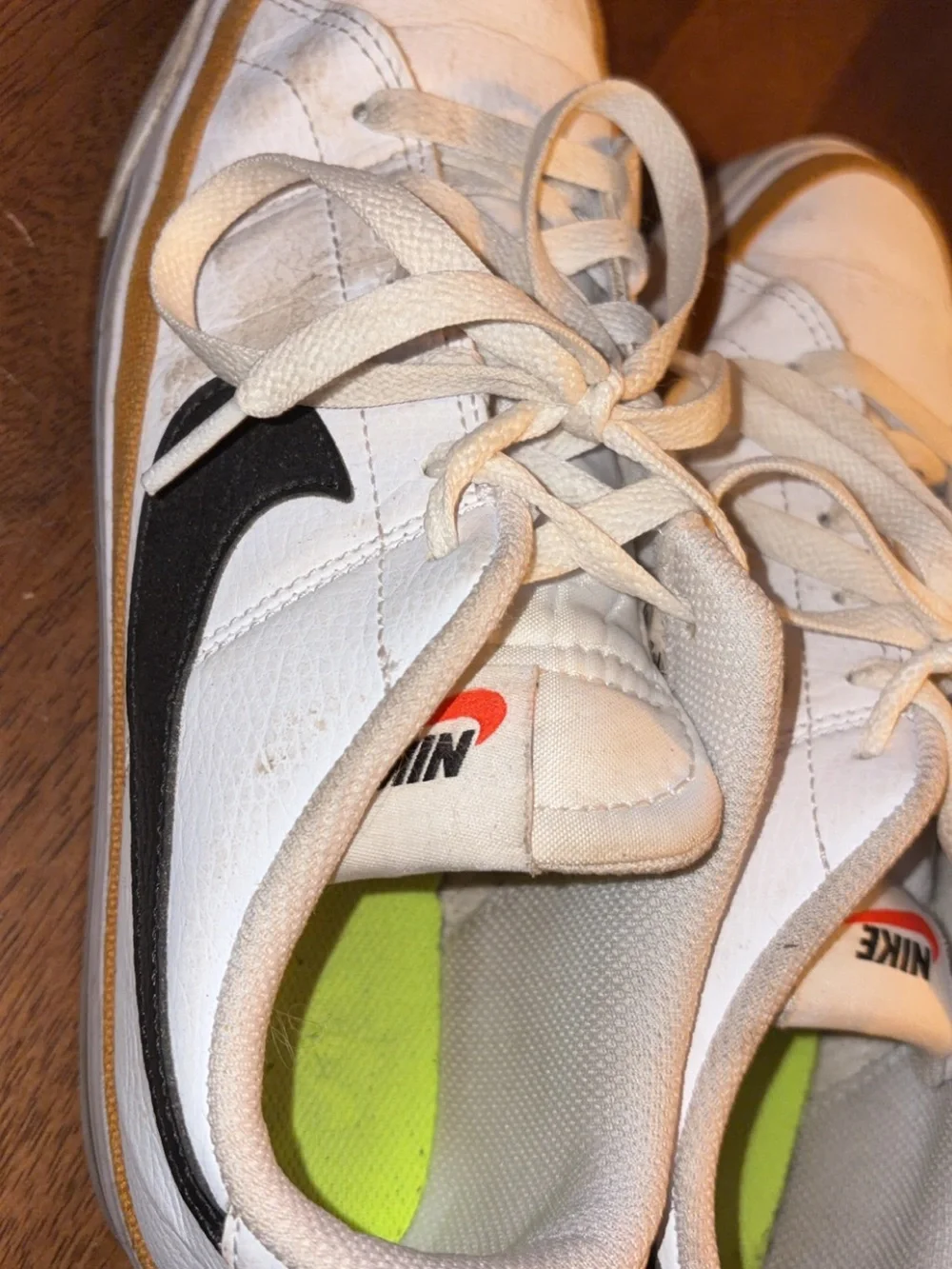 Nike Kids White Sneakers with Black Swoosh and Neon Green Insole